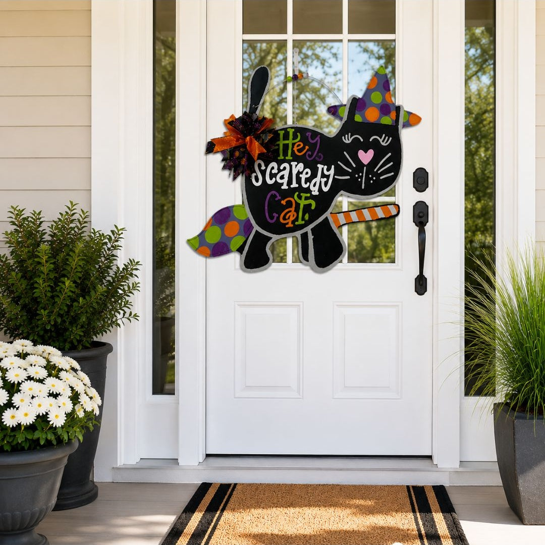 Hand painted Scaredy Cat Halloween door hanger on a white front door